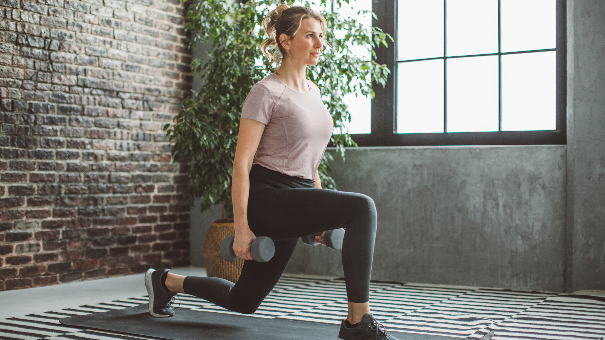Woman exercising with dumbbells